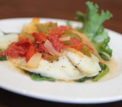 Tilapia Veracruz, fresh fish with vegetables, served by Linden House Assisted Living