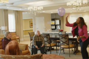 Memory care residents playing balloon ball
