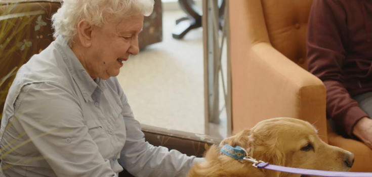 Memory care resident with therapy dog