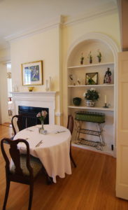A table with three chairs in a dining room