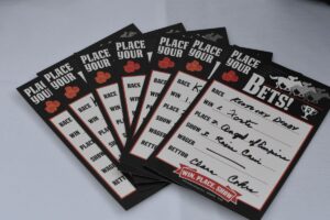 A spread of "Place Your Bet" cards