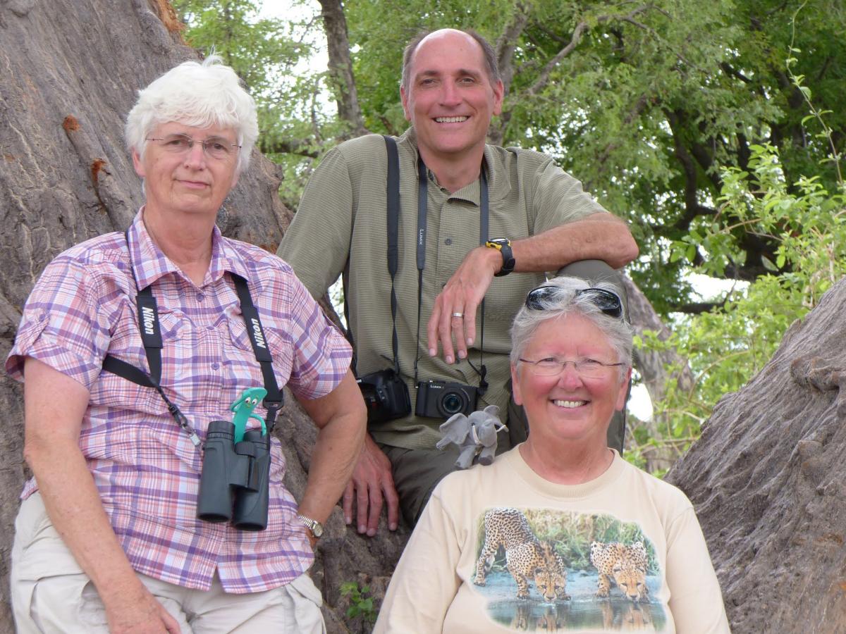 Nancy and two others posing with their cameras in Africa