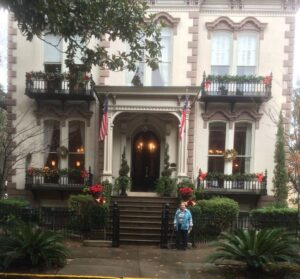 Carol in front of a building in Savannah