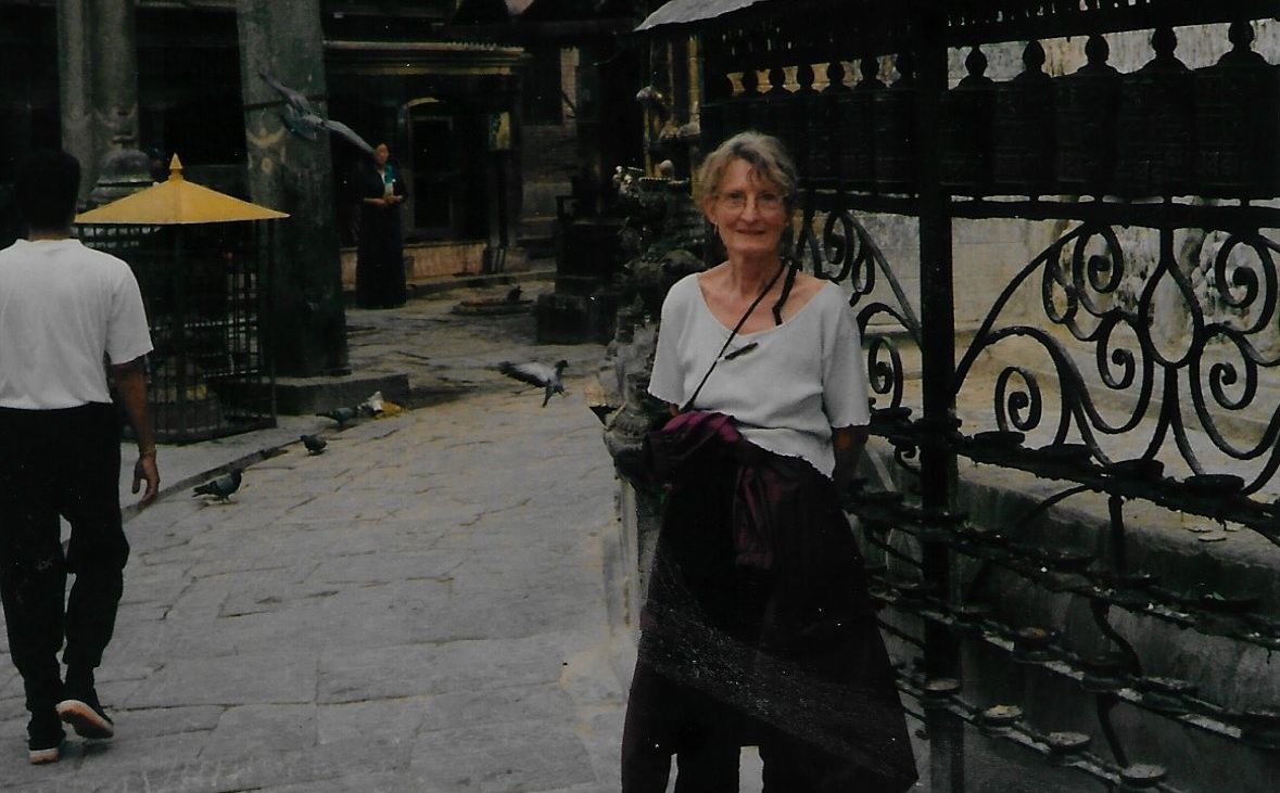 Denise standing in front of a temple in Nepal