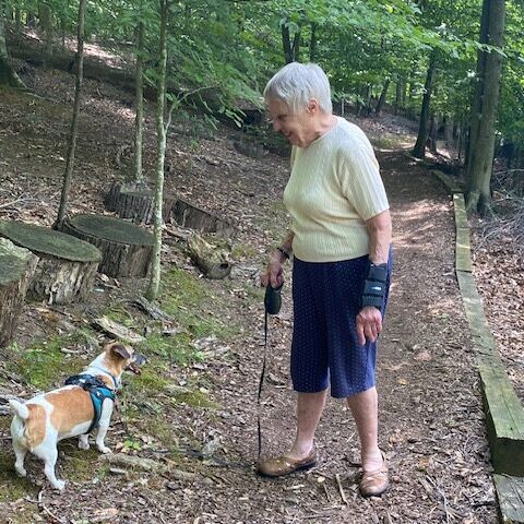 Branchlands resident with her dog on walking trail